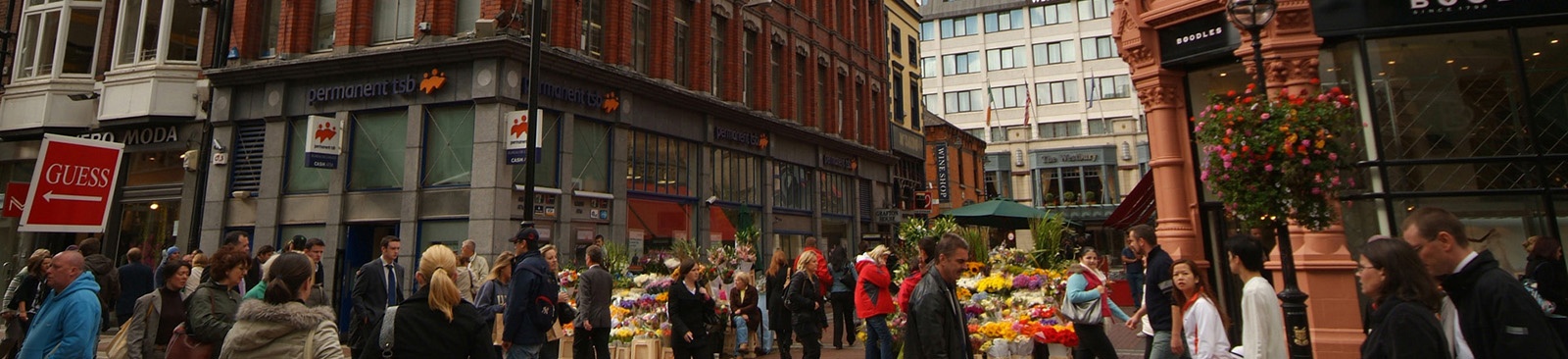 People shopping in a busy shopping area.