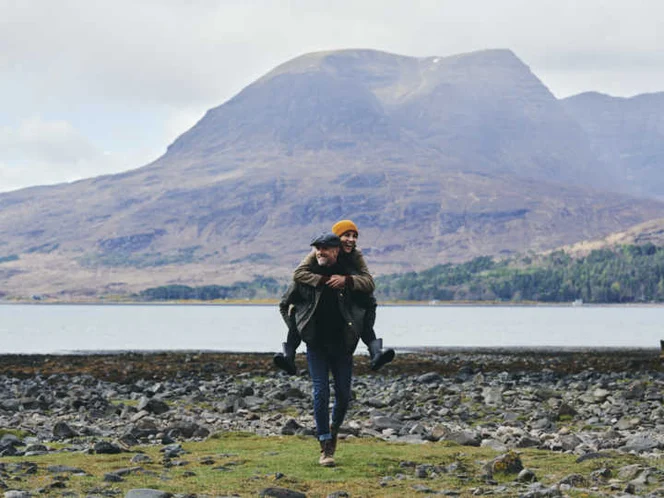 Couple walking near shoreline