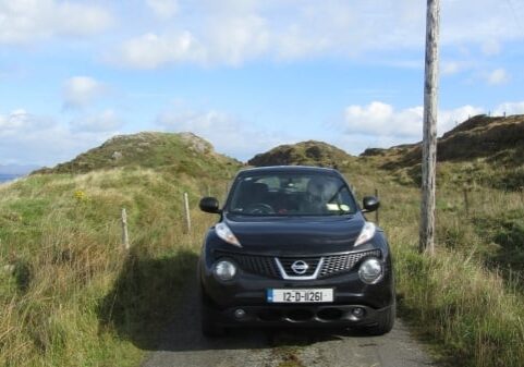 small car on farm road